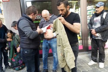 A man is seen injured after clashes between supporters and opponents of the Turkish government  outside the country's consulate in Brussels, in this handout picture released by Firat News Agency in Brussels, Belgium, March 30, 2017.  Courtesy of Firat News Agency/Handout via REUTERS  FOR EDITORIAL USE ONLY. NO RESALES. NO ARCHIVES FOR EDITORIAL USE ONLY. NOT FOR SALE FOR MARKETING OR ADVERTISING CAMPAIGNS THIS IMAGE HAS BEEN SUPPLIED BY A THIRD PARTY. IT IS DISTRIBUTED, EXACTLY AS RECEIVED BY REUTERS, AS A SERVICE TO CLIENTS