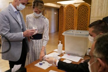 FILE PHOTO: Syria's President Bashar al-Assad and his wife Asma cast their vote inside a polling station during the parliamentary elections in Damascus, Syria in this handout released by SANA on July 19, 2020. SANA/Handout via REUTERS ATTENTION EDITORS - THIS IMAGE WAS PROVIDED BY A THIRD PARTY. REUTERS IS UNABLE TO INDEPENDENTLY VERIFY THIS IMAGE/File Photo