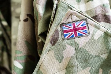 Union Jack flag on the sleeve of British military camouflage uniform shirt sleeve