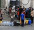 KHAN YUNIS, GAZA - JUNE 28: Palestinians try to meet their daily water needs by filling jerry cans from water tankers brought into the area in Khan Yunis, Gaza on June 28, 2025. In the Gaza Strip, which remains under Israeli attacks, Palestinians are struggling to survive under extremely harsh conditions, deprived of even the most basic necessities such as shelter, food, and clean water. (Photo by Abed Rahim Khatib/Anadolu via Getty Images)